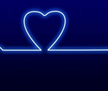 A glowing blue heart rate line on a dark background, with the line forming the shape of a heart in the center 
